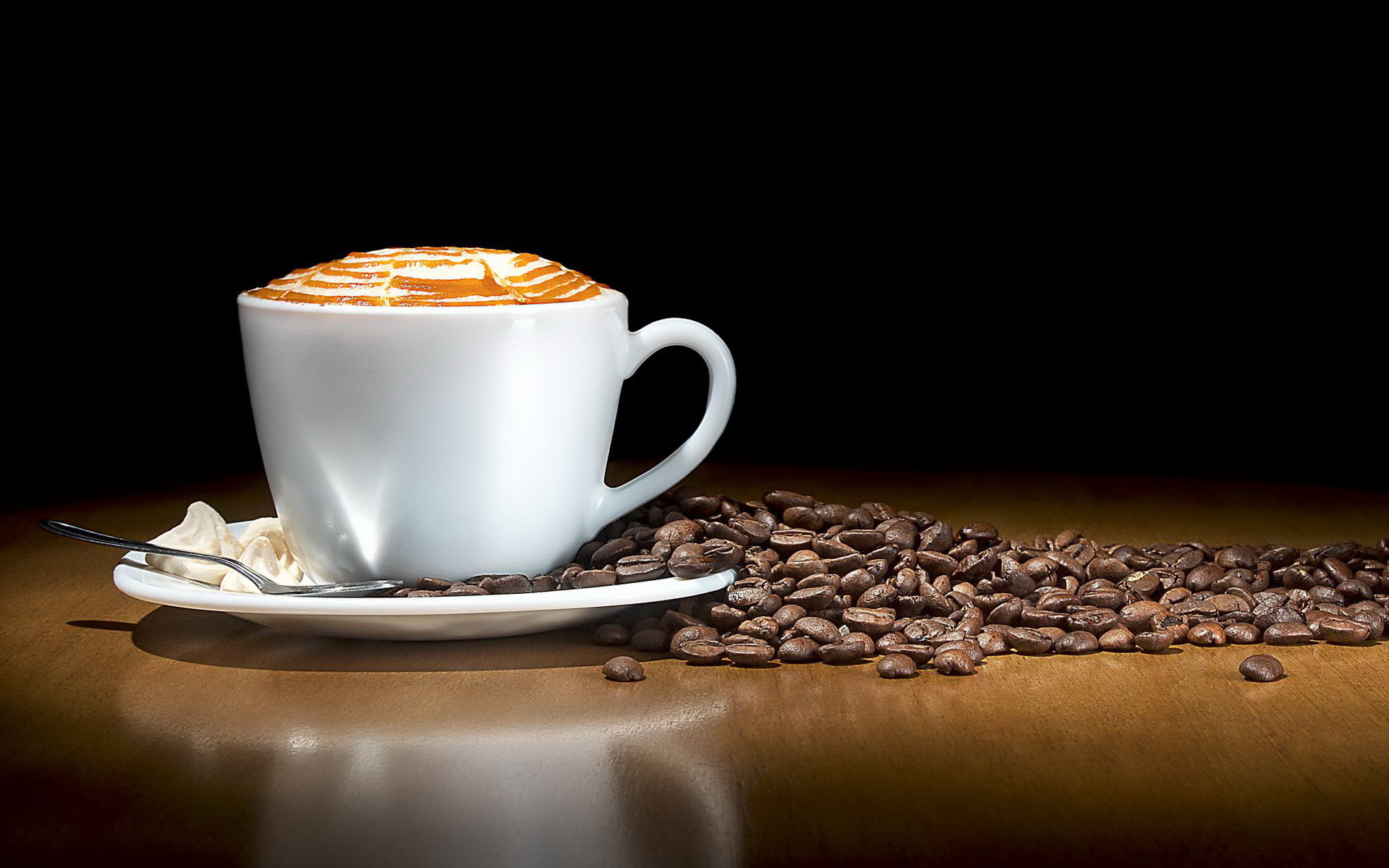 Cup of hot coffee on wooden table at The Daily Cafe